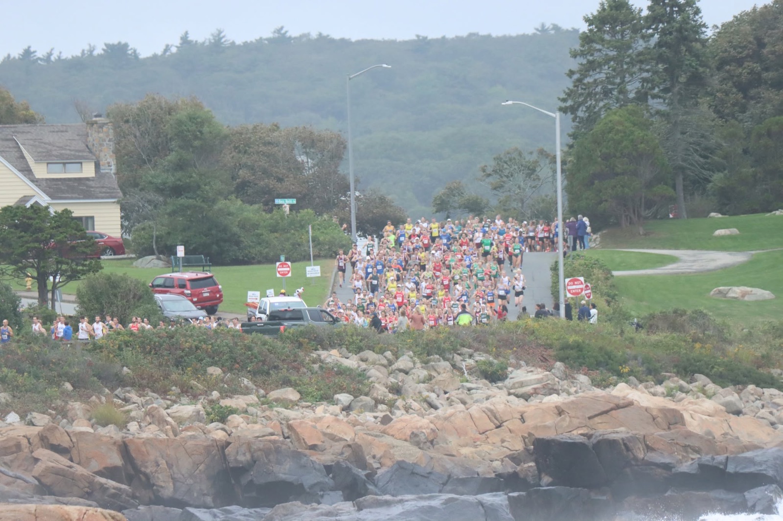 Runners at the Lone Gull 10K start on the Cape Ann coast
